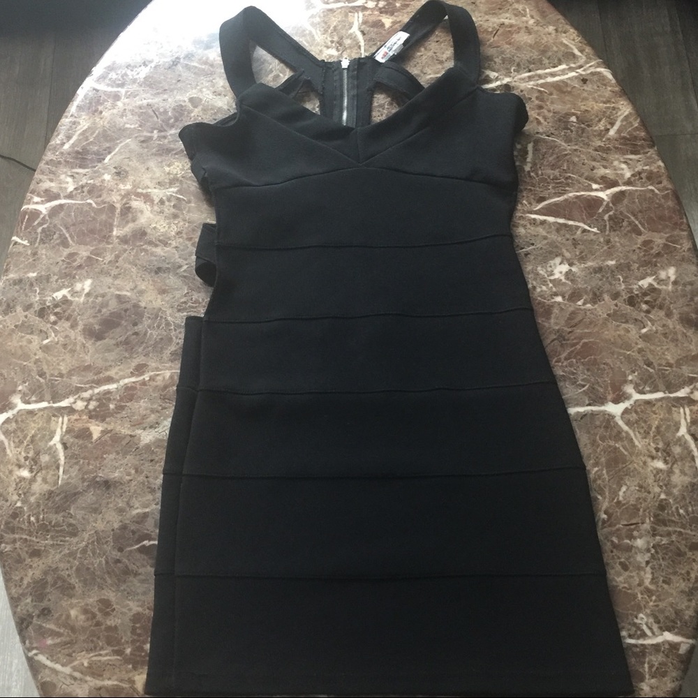 Fitted black dress with back cut out
